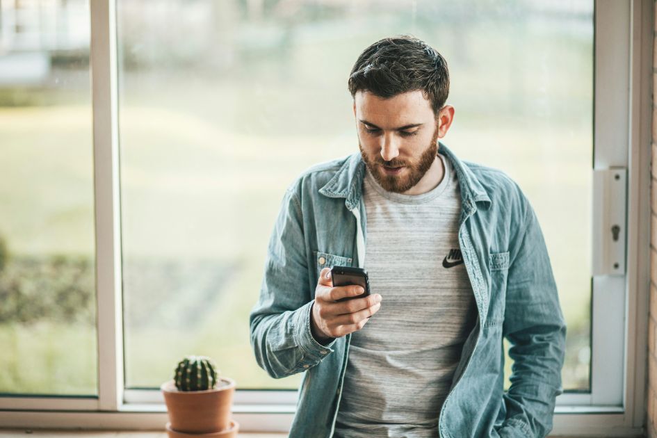 Man viewing sleep tracking insights from COLMI R03 smart ring, the affordable Oura Ring alternative
