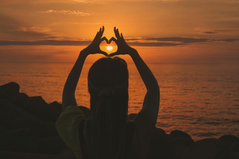 Heart shaped hands indicating sleep optimization