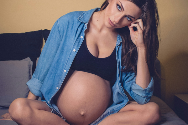 pregnant woman looking at camera