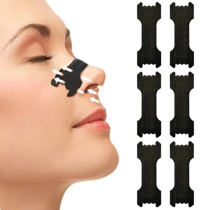 A woman with Restora Dream nasal strip applied, experiencing better sleep quality and clearer nighttime breathing