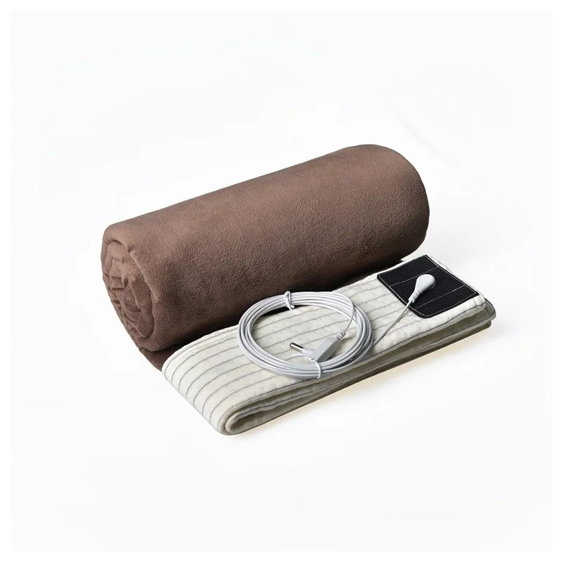 Rolled-up brown grounding blanket with silver fiber and included grounding accessories