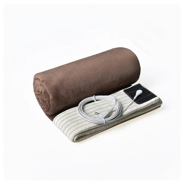 Rolled-up brown grounding blanket with silver fiber and included grounding accessories