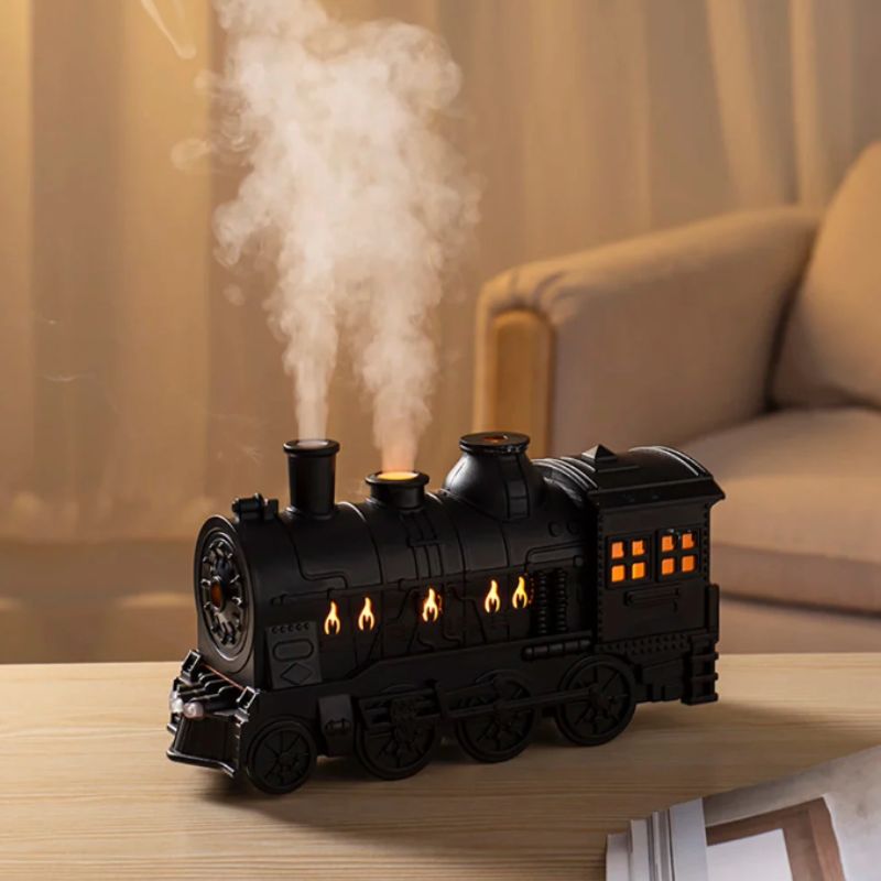 Detailed view of the train-inspired humidifier with steam-like mist and ambient lighting