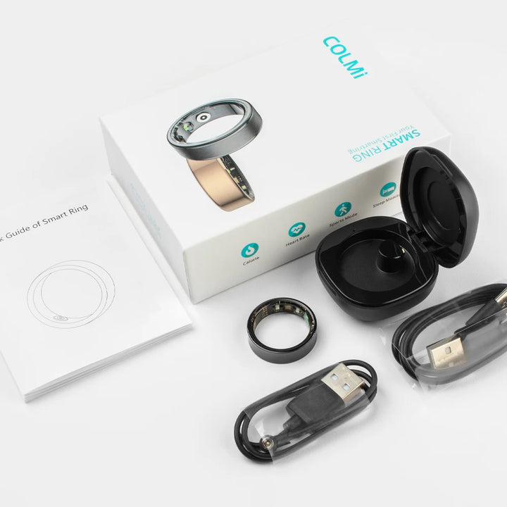 Smart ring with packaging, USB cable, and charging case on a white background