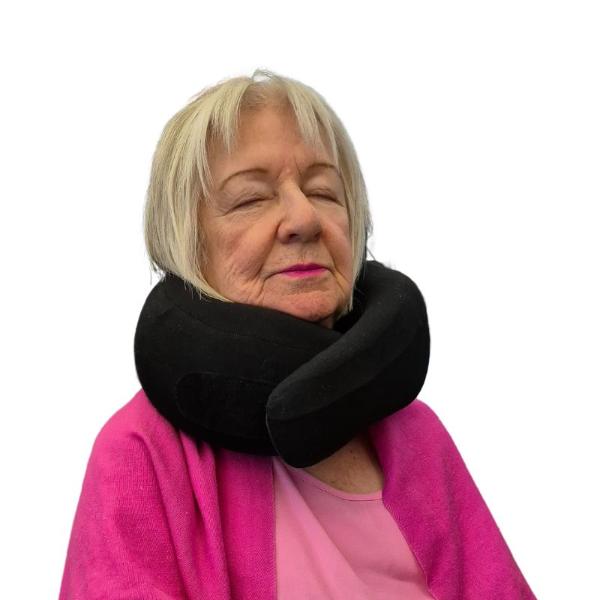 Customer wearing black comfy and supportive travel neck pillow - Restora Dream