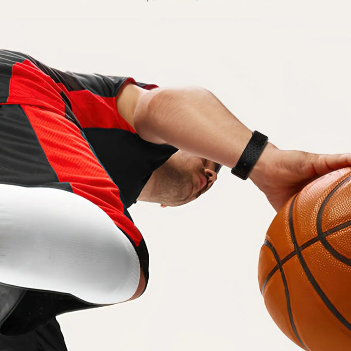 Person holding a basketball with Smart Sleep Band from Restora Dream