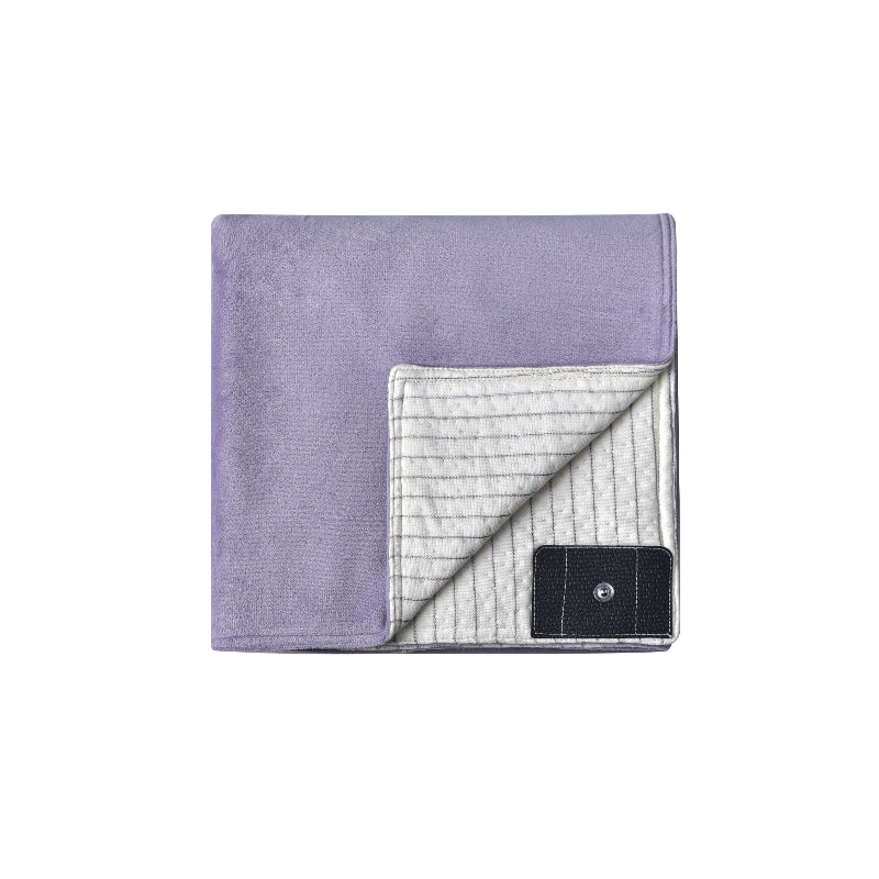 Purple grounding blanket folded, highlighting its conductive silver fiber underside