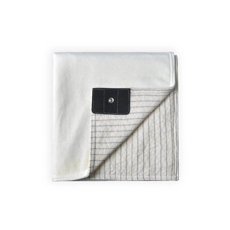 Grounding blanket with a soft white top layer and conductive silver fiber underside